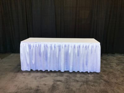 Table with white pleated skirting